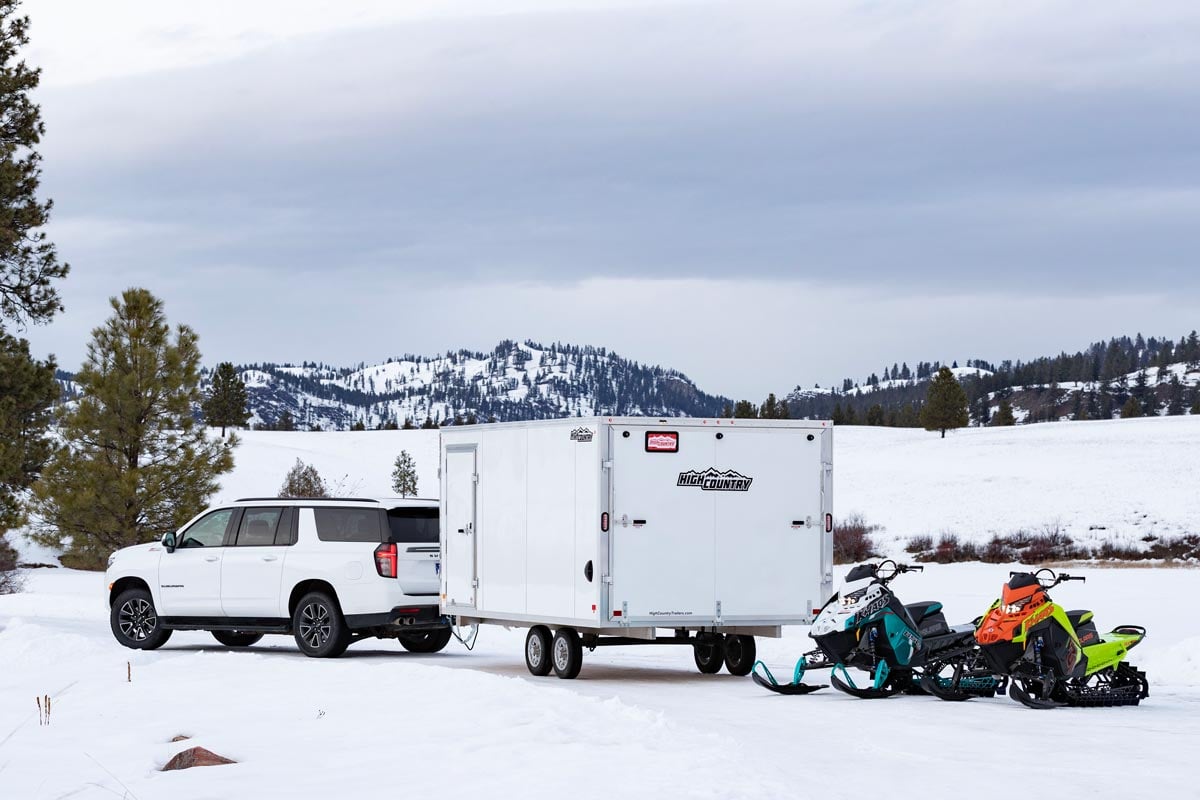 High Country Enclosed Deckover Lite Snow Trailer Parked With Snowmobiles